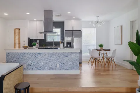 a view of a kitchen and dining area