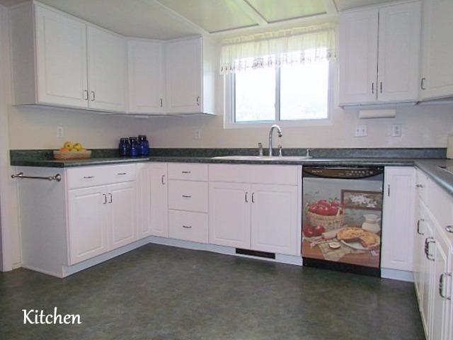 6710 North Applegate Road Grants Pass, OR 97527 - Photo 6 of 33 a kitchen with granite countertop white cabinets and sink