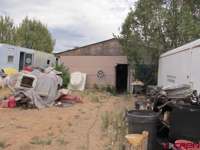 25333 Cedar Mesa Road Cedaredge, CO 81413 - Photo 9 of 19 a view of backyard of the house