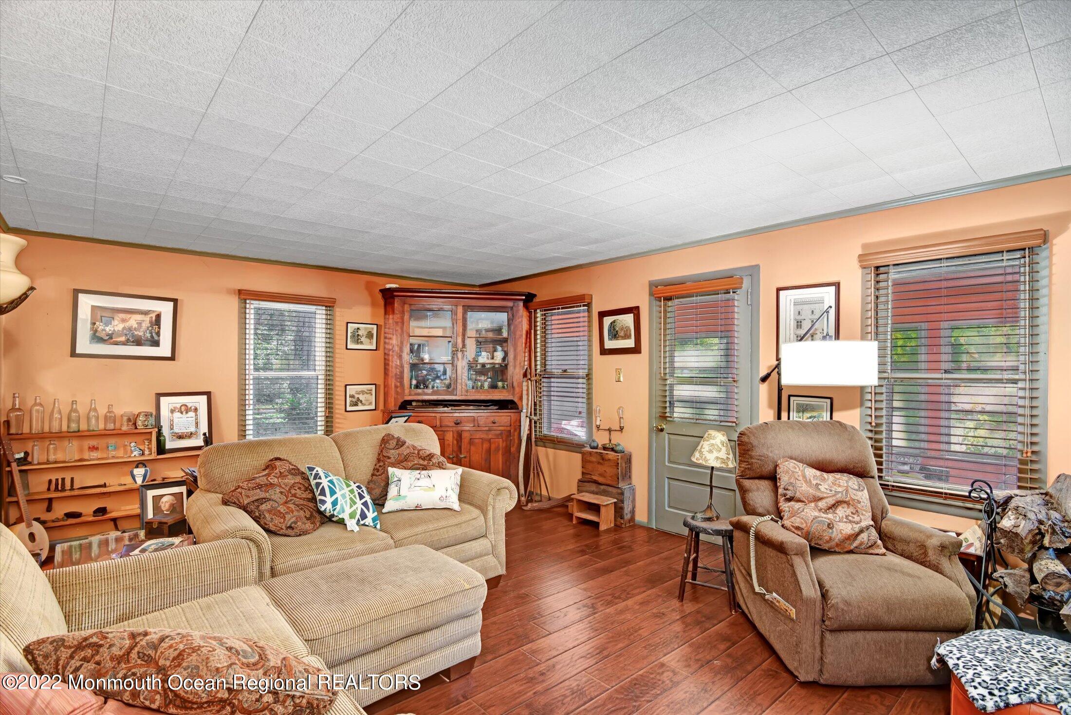 844 Monmouth Road Cream Ridge, NJ 08514 - Photo 6 of 11 a living room with furniture and large windows