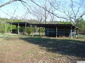 6049 Cress Road Concord, NC 28025 - Photo 3 of 8 a front view of a house with garden