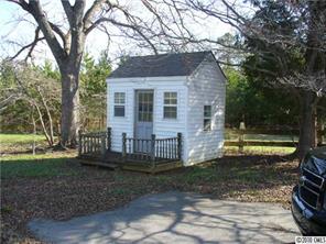 6049 Cress Road Concord, NC 28025 - Photo 4 of 8 a view of a house with a yard