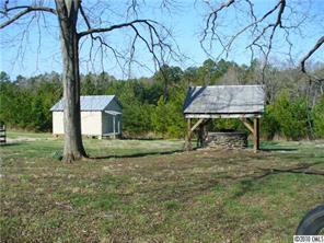 6049 Cress Road Concord, NC 28025 - Photo 6 of 8 a view of a chair and table in the yard