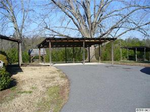 6049 Cress Road Concord, NC 28025 - Photo 7 of 8 a view of a house with backyard and trees