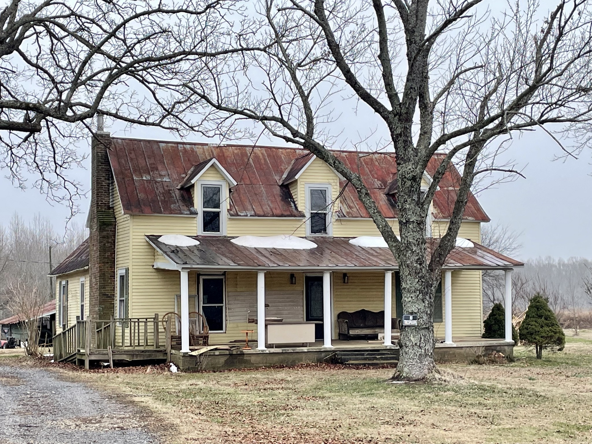136 Scott Orchard Road Taft, TN 38488 - Photo 1 of 29 a front view of a house with a tree