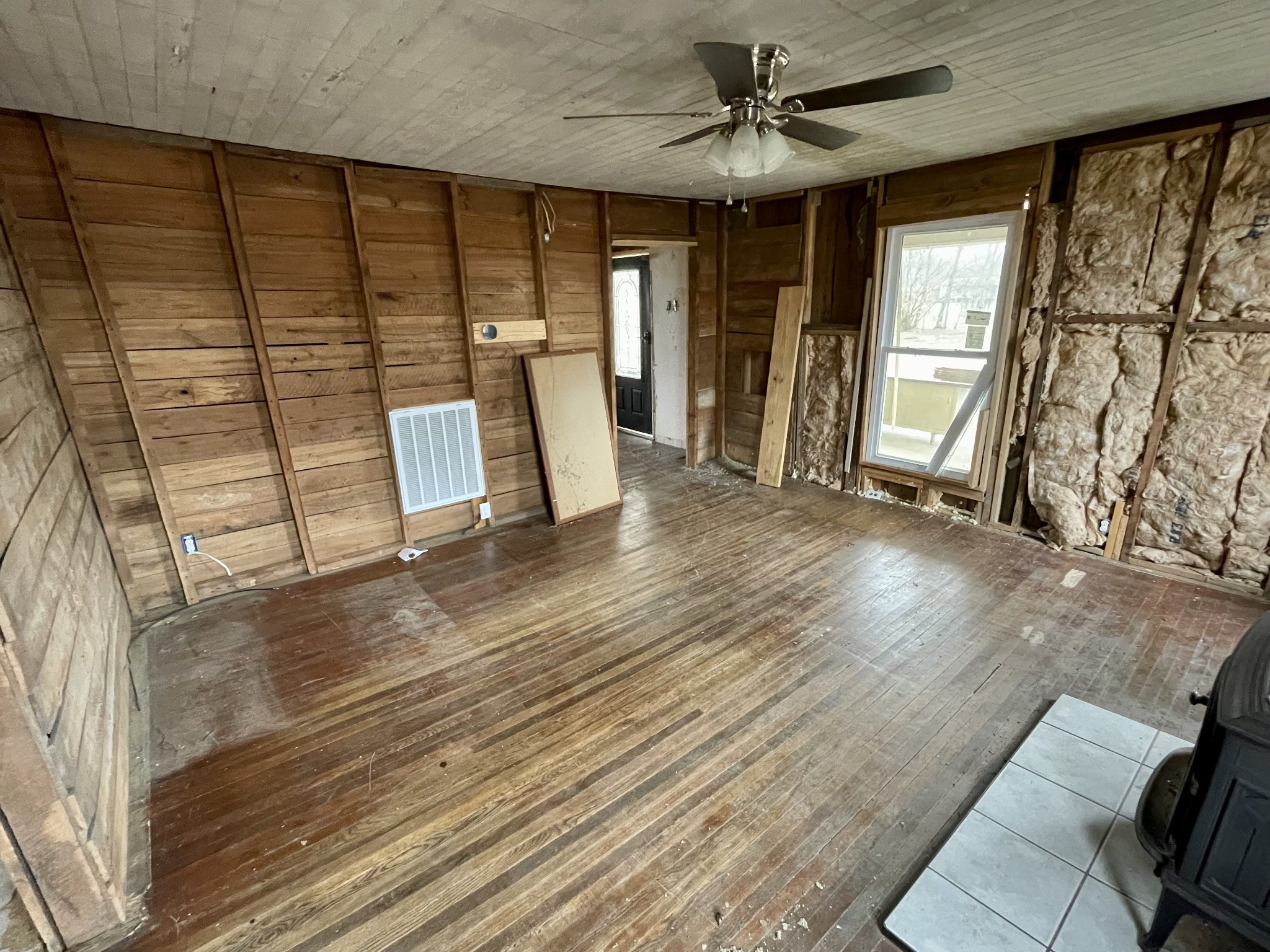 136 Scott Orchard Road Taft, TN 38488 - Photo 13 of 29 a view of an empty room with a window and wooden floor