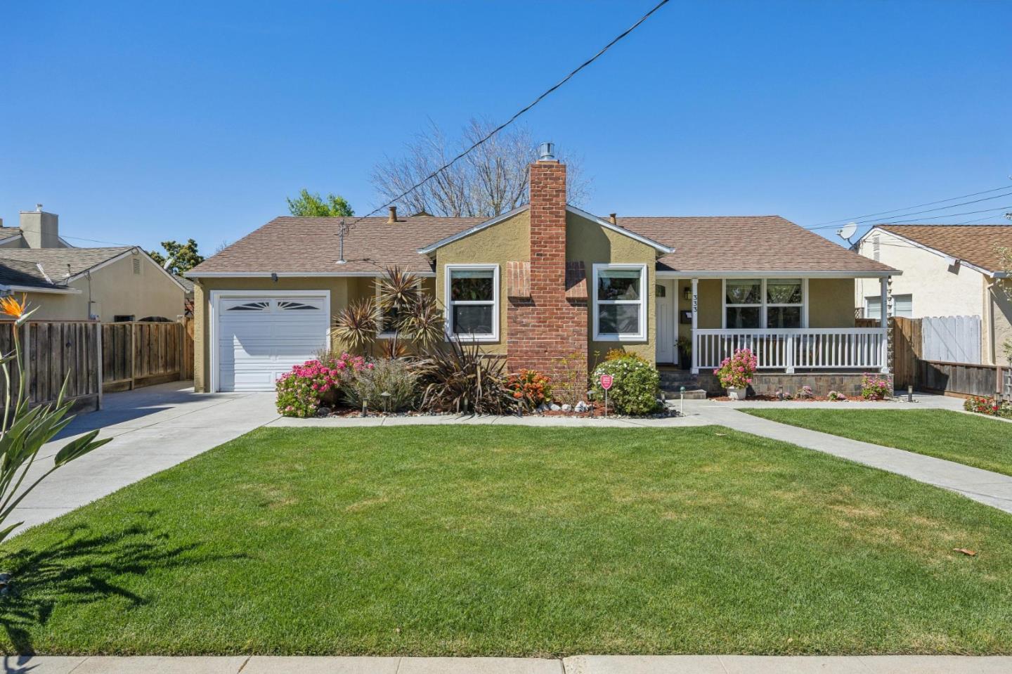 a front view of a house with a yard