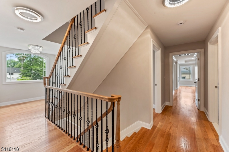 118 Cambridge Road Westfield, NJ 07090 - Photo 22 of 50 a view of a hallway with wooden floor and entryway