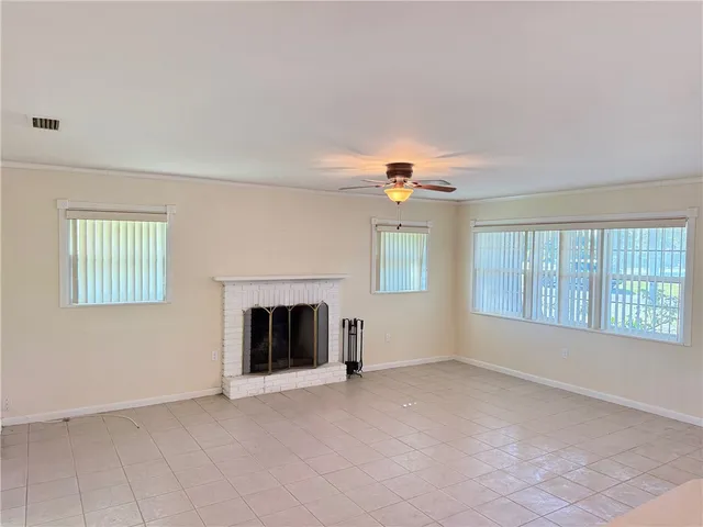 a view of an empty room and a window