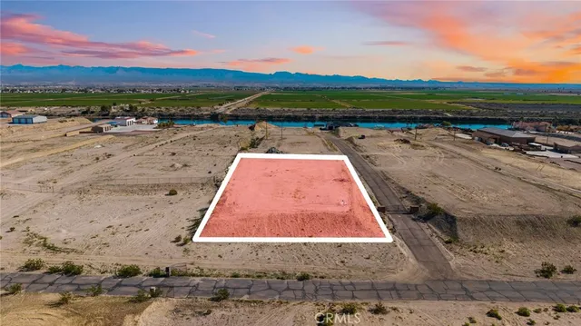 a view of swimming pool with outdoor seating and city view