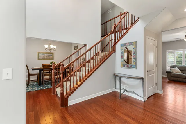 a view of entryway and hall with wooden floor