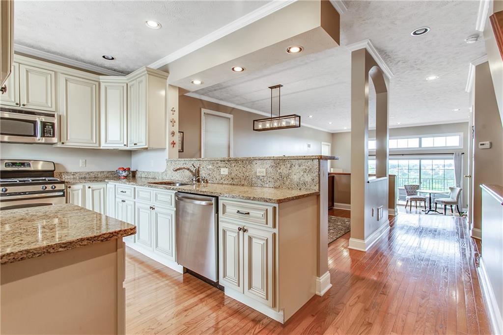 238 Prospect Street Pittsburgh, PA 15211 - Photo 2 of 21 Right when you step in the door you are greeted with a modern kitchen filled with natural light and the stairs to the second level on your right.