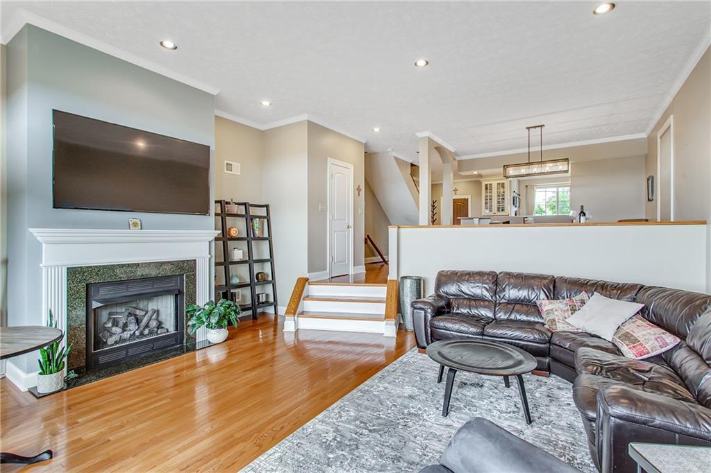 238 Prospect Street Pittsburgh, PA 15211 - Photo 8 of 21 Spacious living room with gas fireplace, recess lighting and stunning view off the balcony.