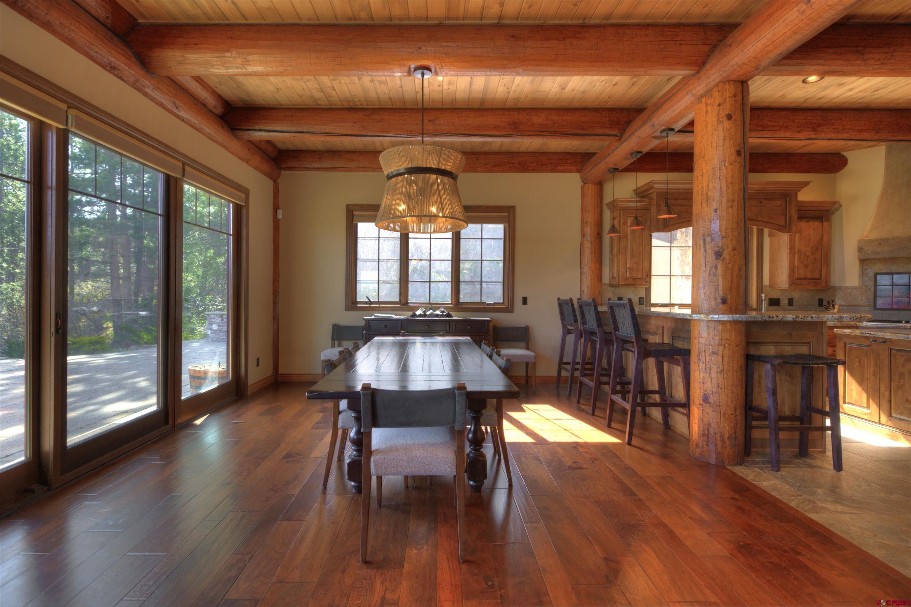 702 Jenni Lane, Unit SADDLEHORN RANCH Chromo, CO 81128 - Photo 11 of 45 a view of a dining room with furniture window and wooden floor