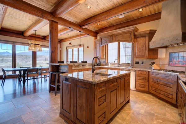 a kitchen with sink stove and cabinets