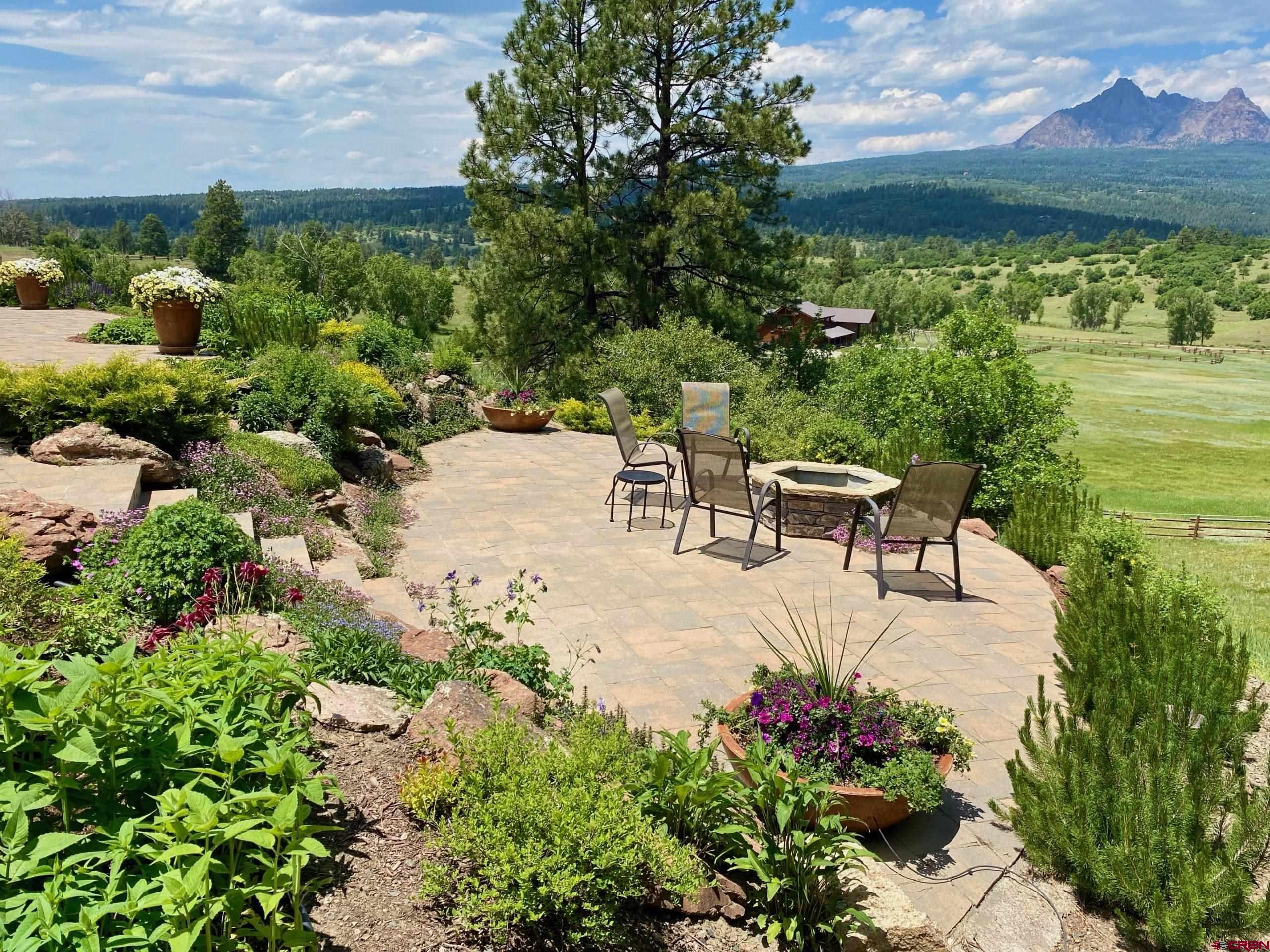 702 Jenni Lane, Unit SADDLEHORN RANCH Chromo, CO 81128 - Photo 28 of 45 a view of a garden with an outdoor seating