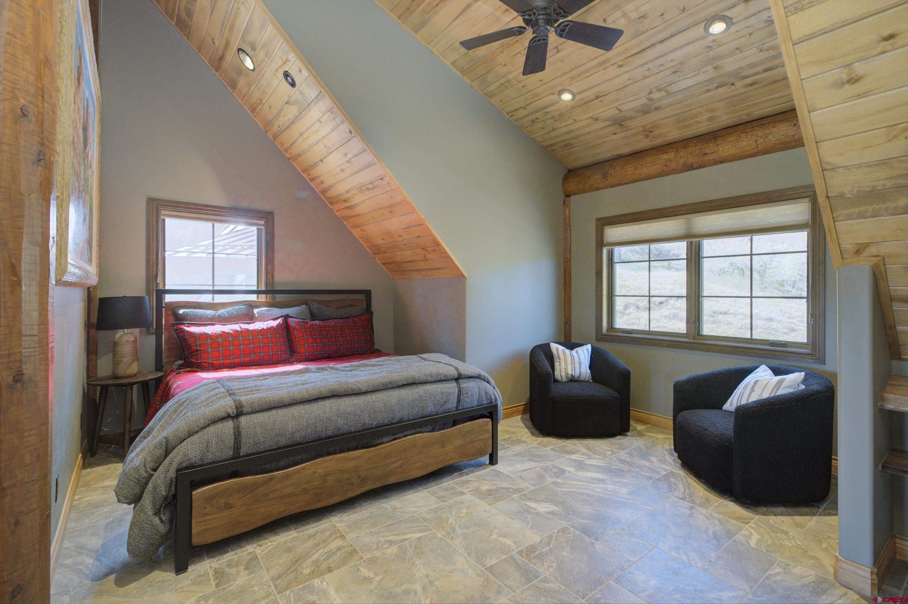 702 Jenni Lane, Unit SADDLEHORN RANCH Chromo, CO 81128 - Photo 40 of 45 a bedroom with bed and a large window