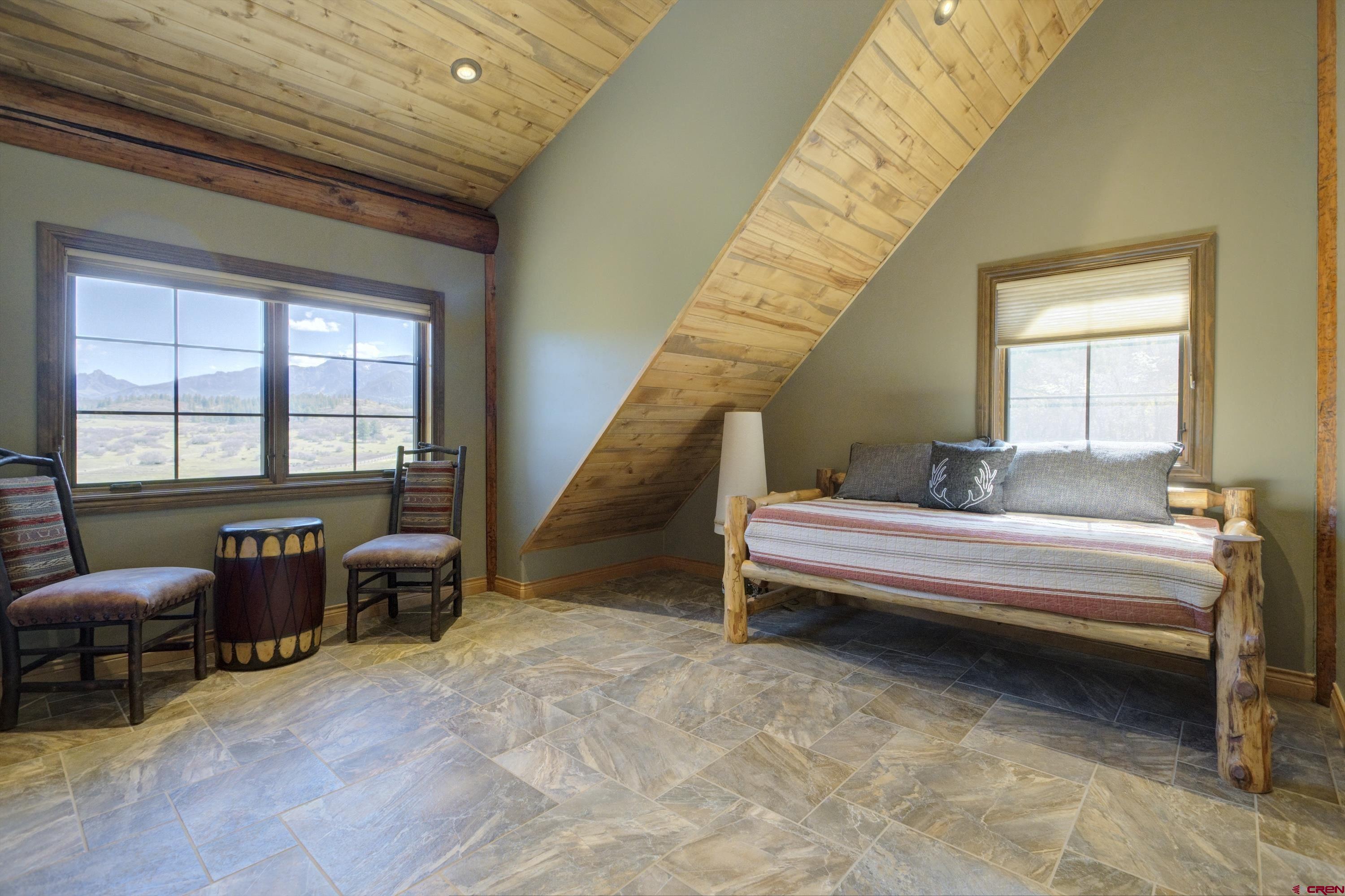 702 Jenni Lane, Unit SADDLEHORN RANCH Chromo, CO 81128 - Photo 41 of 45 a bedroom with furniture and a window