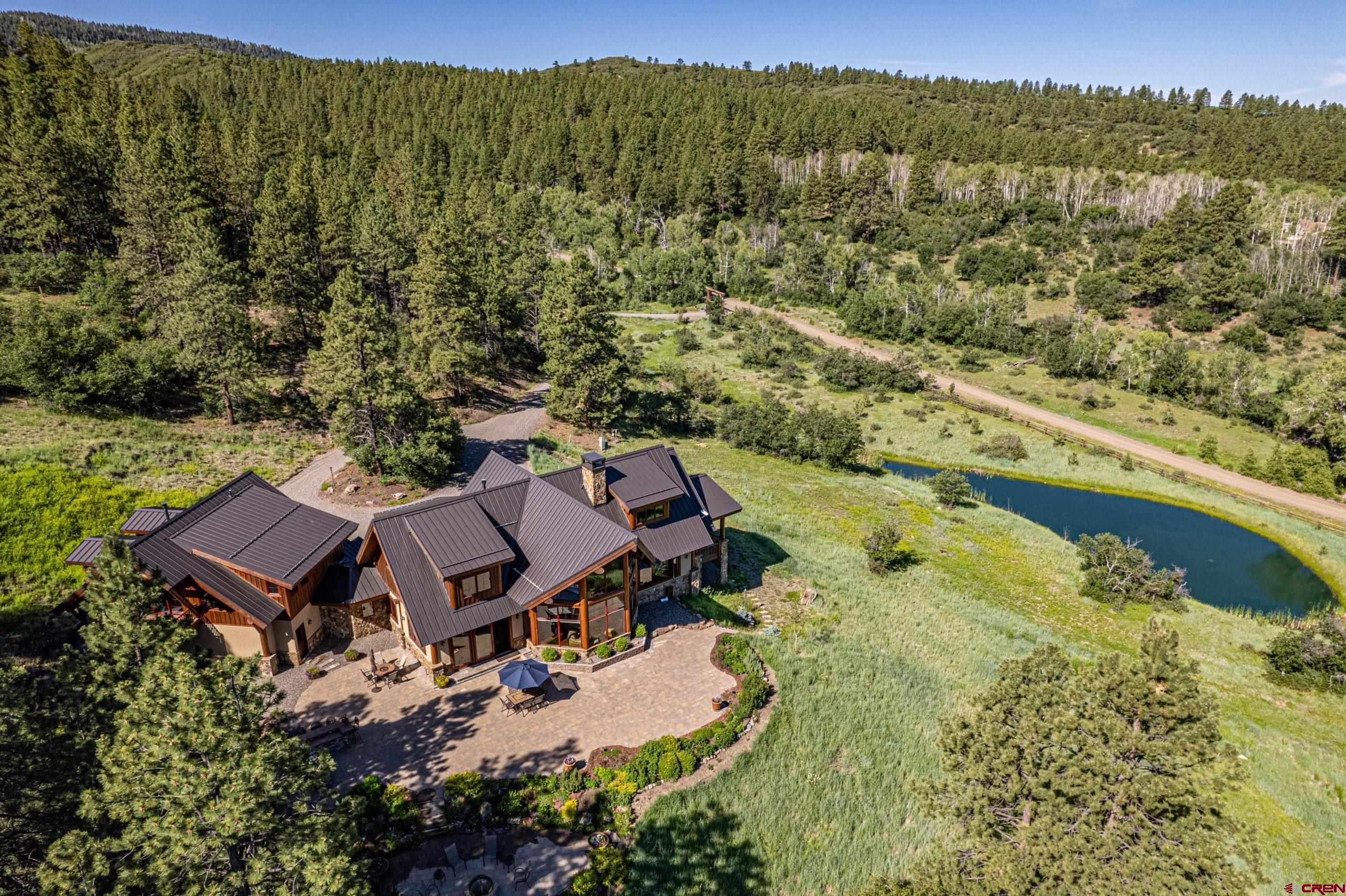 702 Jenni Lane, Unit SADDLEHORN RANCH Chromo, CO 81128 - Photo 7 of 45 an aerial view of a house with a garden