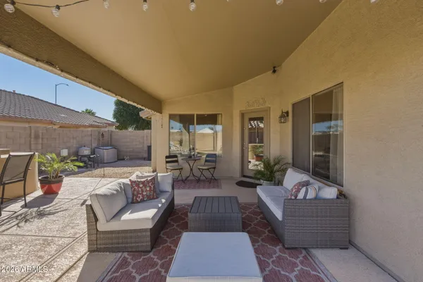 a terrace with outdoor seating and city view