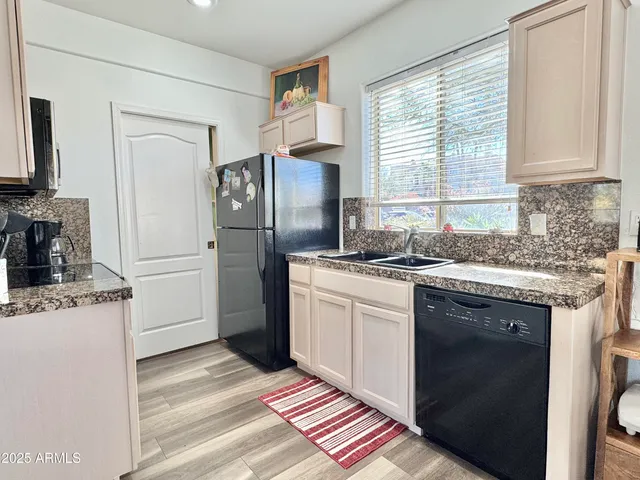 a kitchen with stainless steel appliances granite countertop a stove and a sink