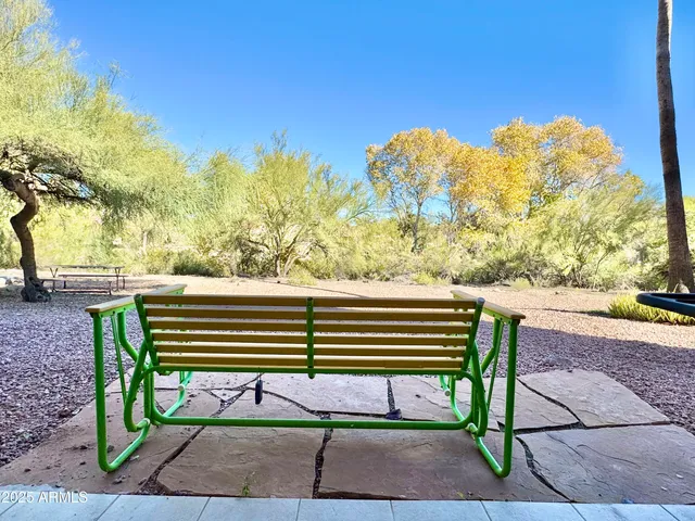 a view of outdoor space with seating and trees