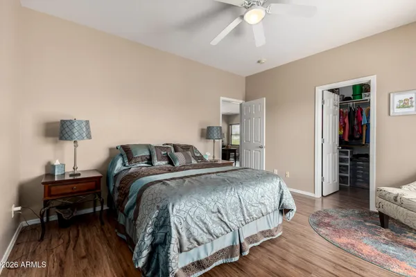 a bedroom with a bed and a chandelier