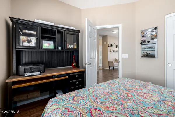 a bedroom with a bed and a dresser