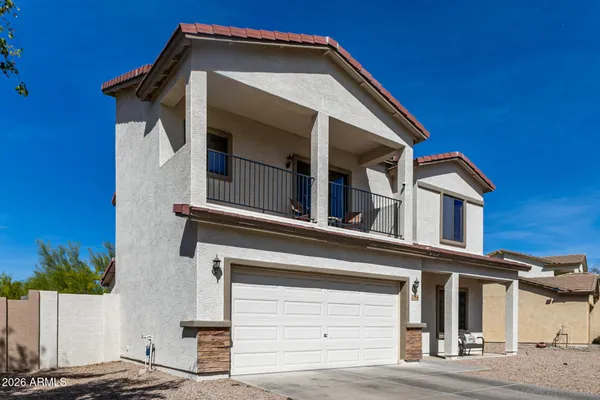 a view of a house with a small yard