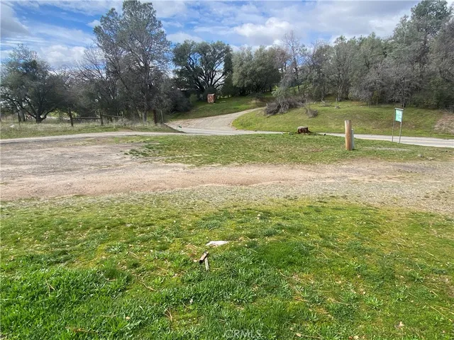 a view of outdoor space with trees all around