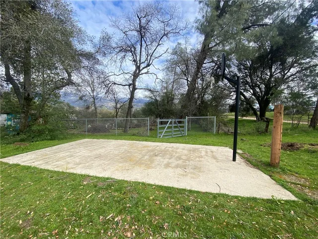 a view of a garden with basketball court