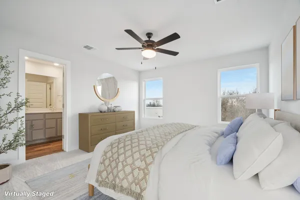 a bedroom with a bed and a dresser