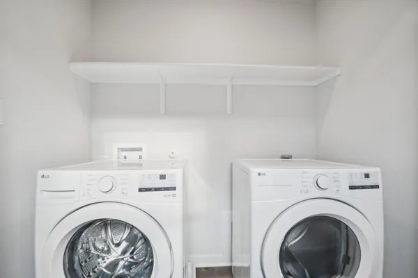 a view of livingroom with washer and dryer