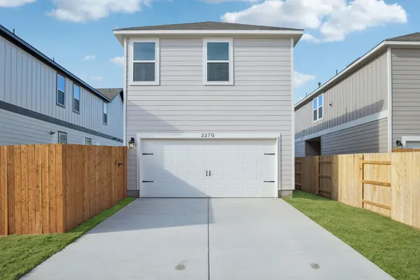 a view of a house with a garage