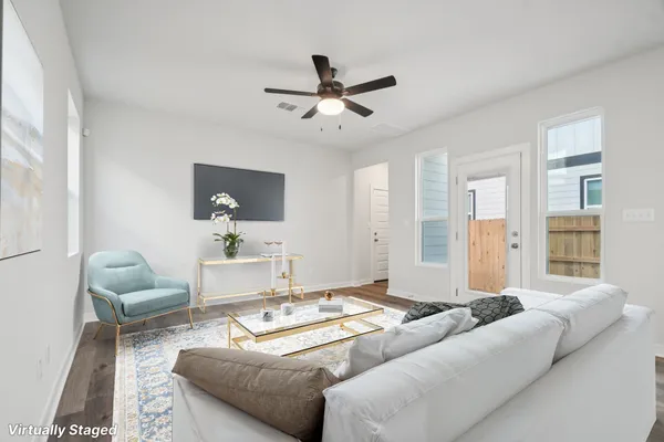 a living room with furniture and a large window