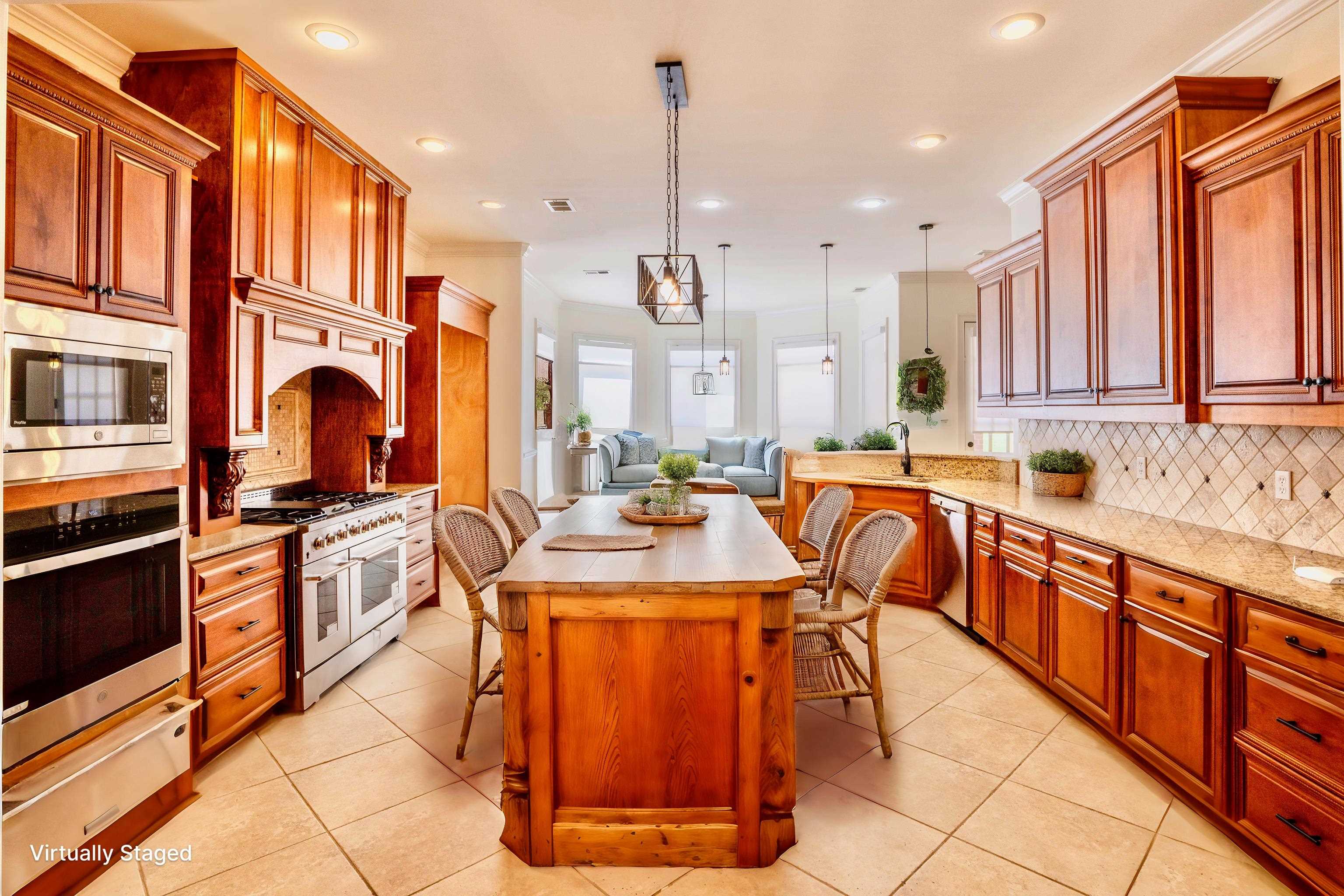 205 Jamerson Farm Road Collierville, TN 38017 - Photo 33 of 33 Kitchen featuring decorative backsplash, light tile patterned flooring, a breakfast bar, appliances with stainless steel finishes, and open floor plan