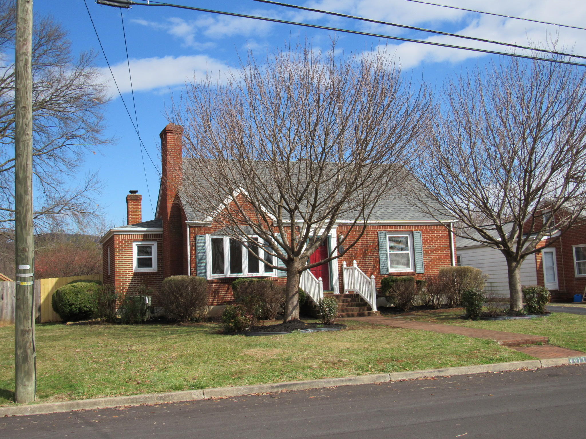 4413 Hazelridge Road Northwest Roanoke, VA 24012 - Photo 2 of 23 a front view of a house with a garden and trees
