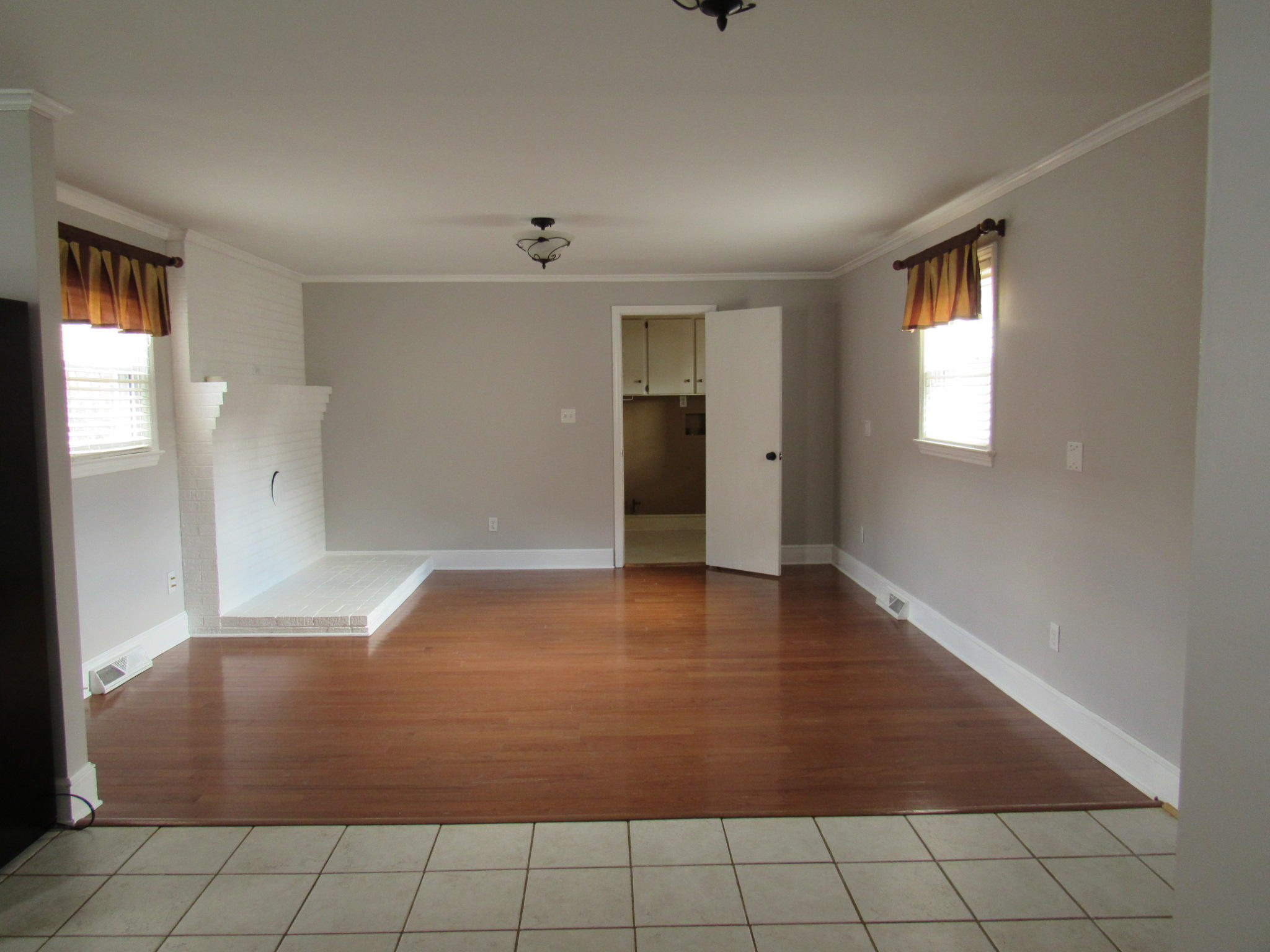 4413 Hazelridge Road Northwest Roanoke, VA 24012 - Photo 11 of 23 wooden floor in an empty room with a window