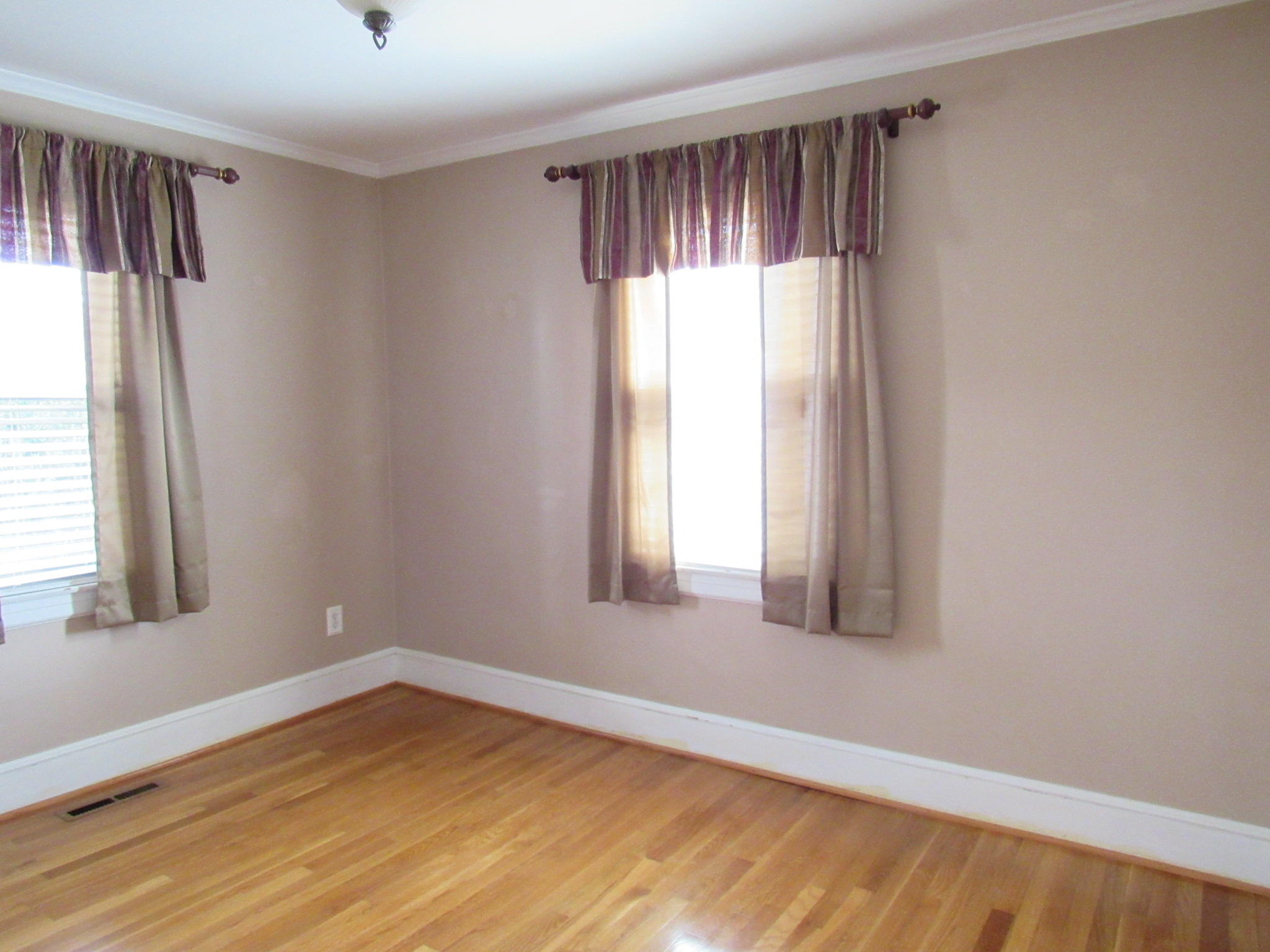 4413 Hazelridge Road Northwest Roanoke, VA 24012 - Photo 19 of 23 a view of an empty room with wooden floor and a window