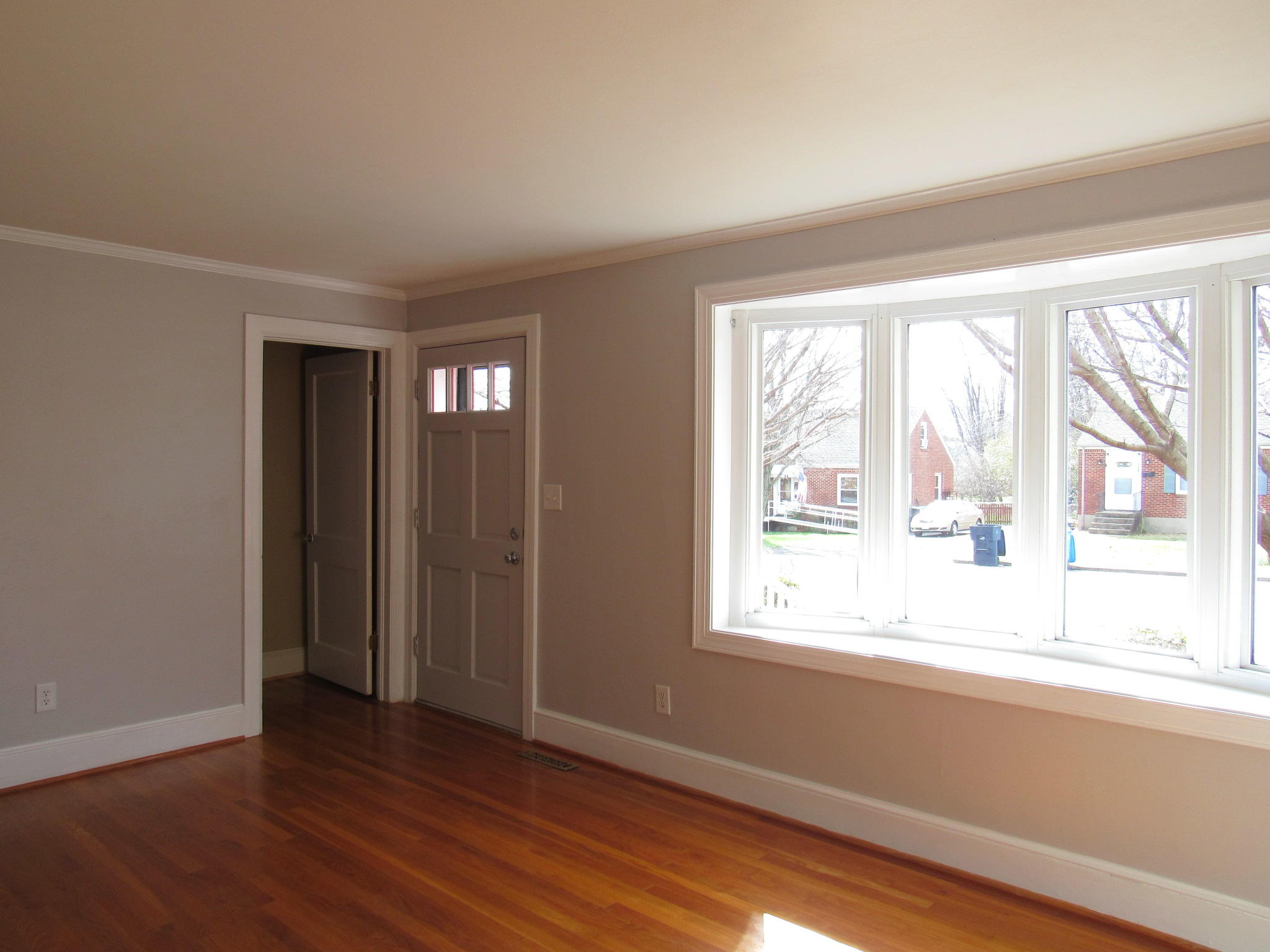 4413 Hazelridge Road Northwest Roanoke, VA 24012 - Photo 8 of 23 a view of an empty room with wooden floor and a window