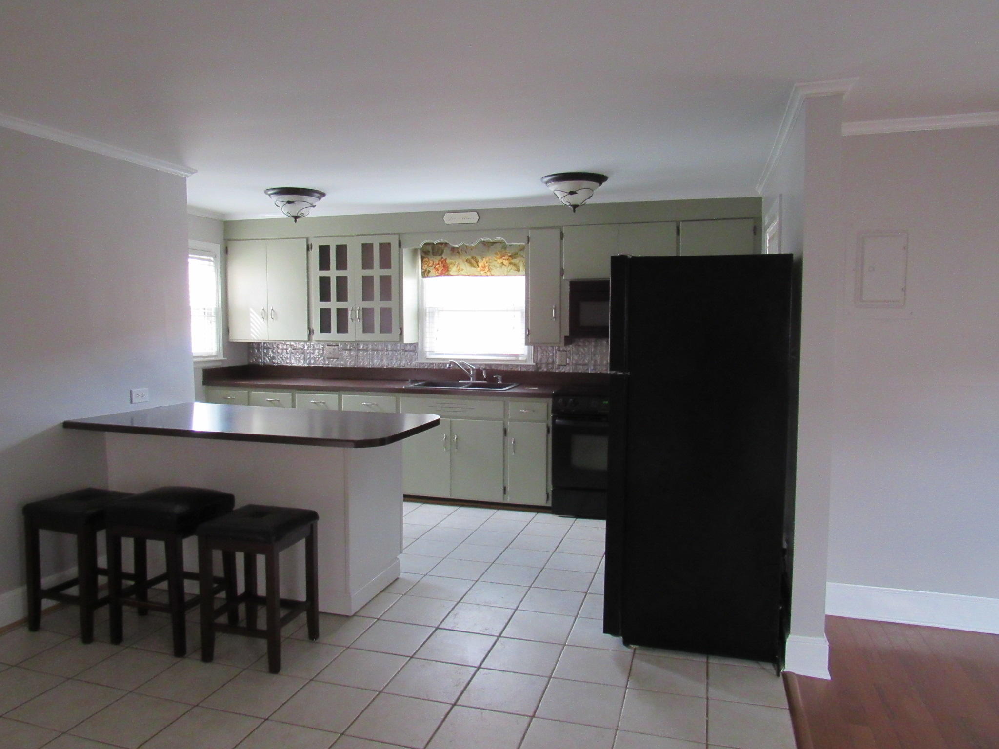 4413 Hazelridge Road Northwest Roanoke, VA 24012 - Photo 10 of 23 a kitchen with a sink a counter top space and stainless steel appliances