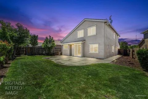 a aerial view of a house with a yard