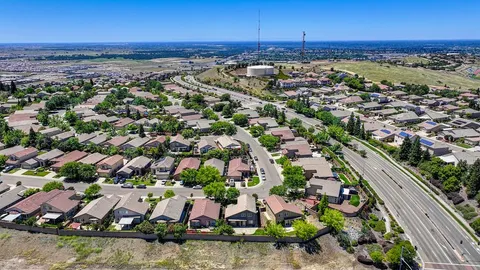 an aerial view of residential houses with outdoor space