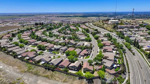 an aerial view of residential houses with outdoor space