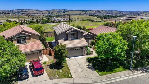 an aerial view of a house with a balcony