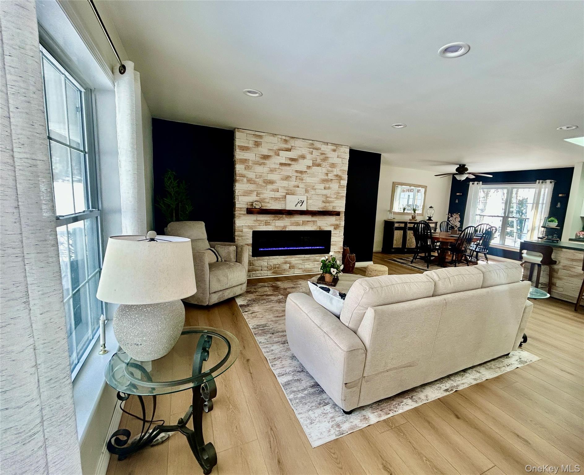 290 Gulf Road Roscoe, NY 12776 - Photo 21 of 30 Living room featuring a stone fireplace, light wood finished floors, a ceiling fan, and recessed lighting