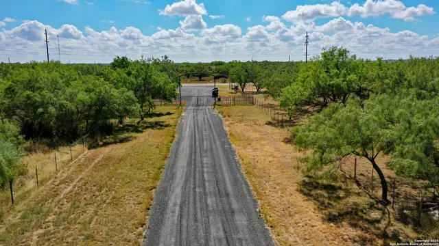 a view of a big yard with an outdoor space