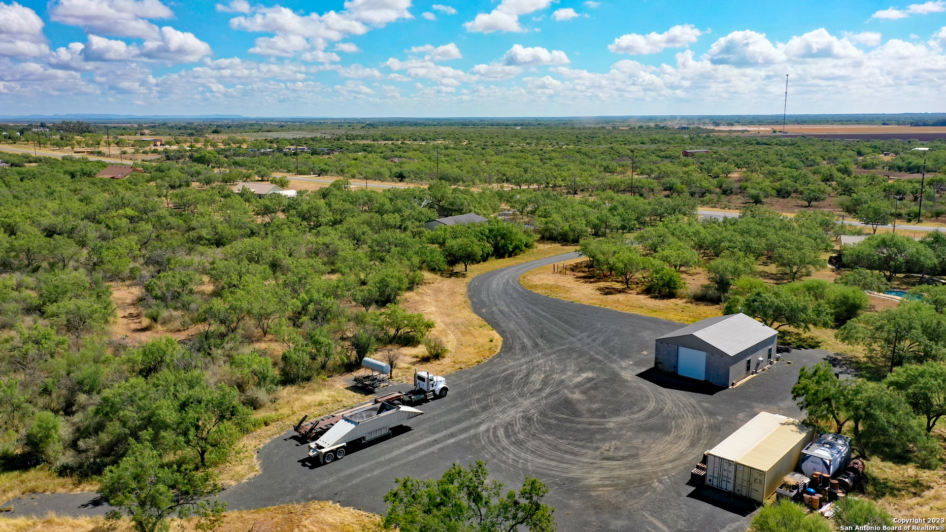 1066 Ranch Rd Highway Sabinal, TX 78881 - Photo 9 of 14 an aerial view of a house with a yard
