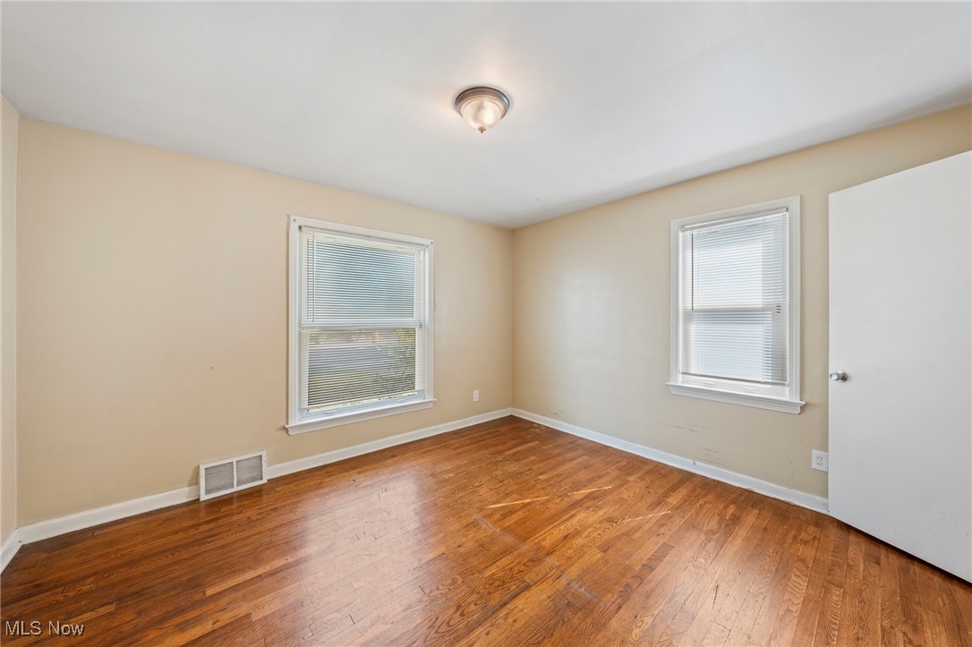 14804 Rockside Road Maple Heights, OH 44137 - Photo 32 of 44 Empty room with wood finished floors and baseboards