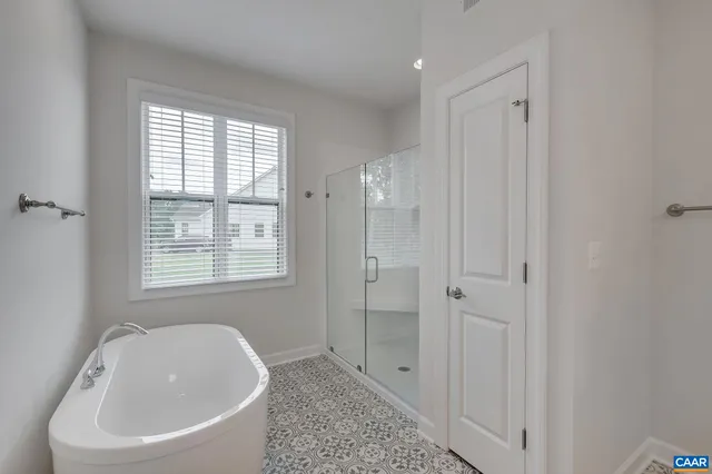 a white bath tub sitting next to a white sink